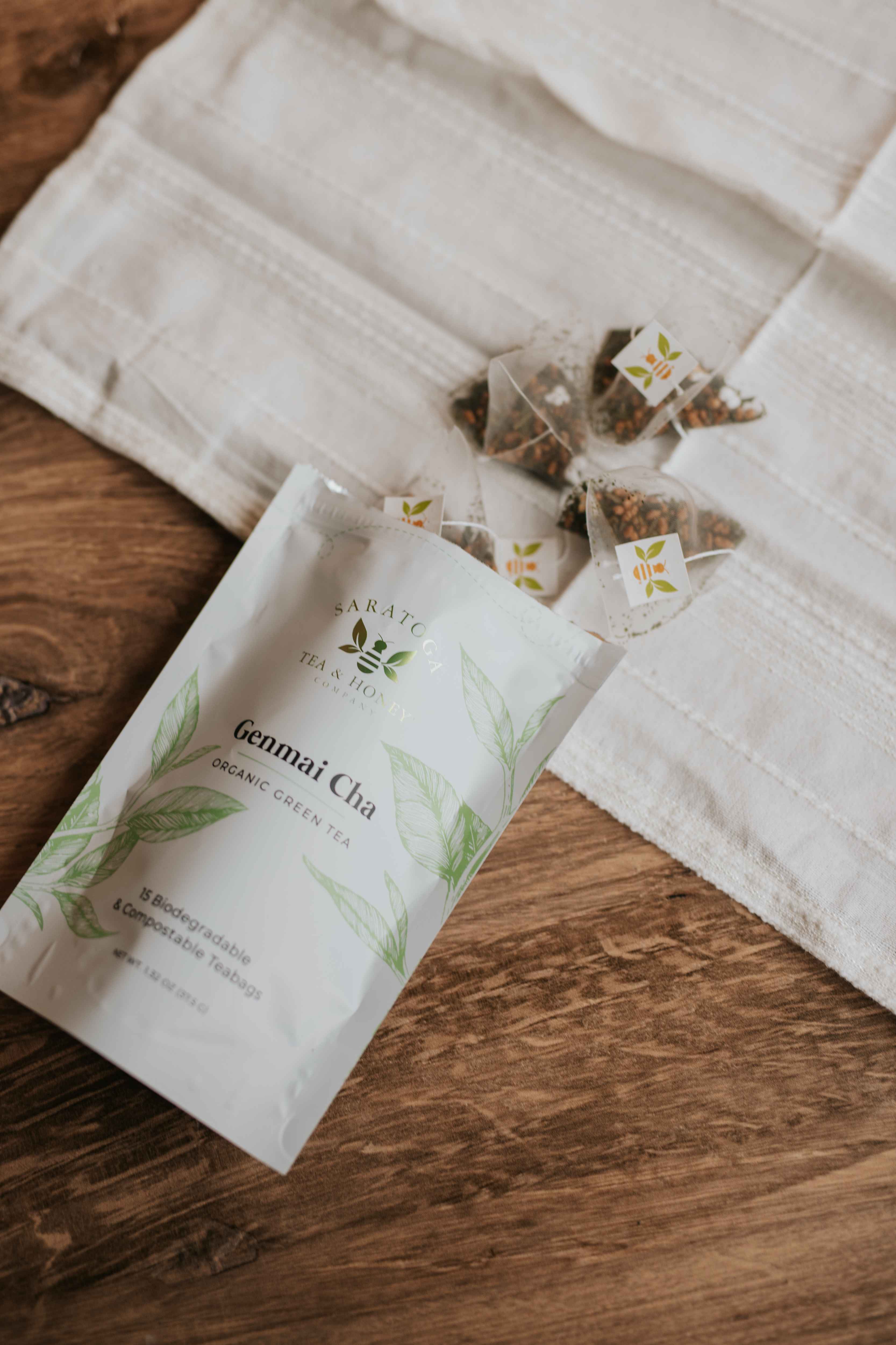 Genmai Cha green tea sachets spill out of a bag.